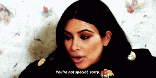 a close up of a woman eating a hamburger and saying `` you 're not special , sorry '' .