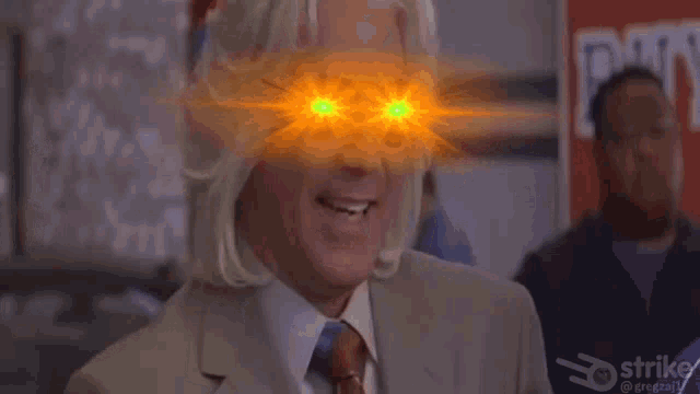 a man in a suit and tie has glowing eyes and says " i can feel it all the way down in my plums "