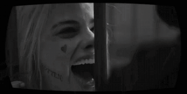 a black and white photo of a woman with the words # release the ayer cut in red