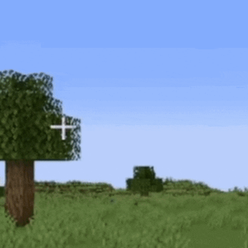 a tree in the middle of a grassy field with a cross in the sky .