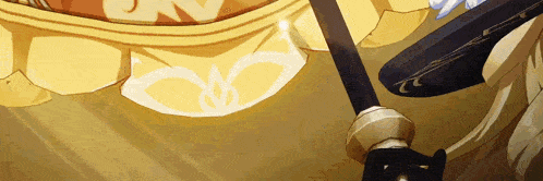 a close up of a person holding a sword with a yellow cloth in the background