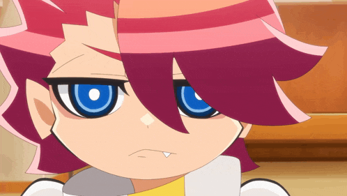 a close up of a cartoon character 's face with blue eyes