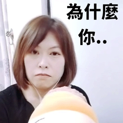 a woman wearing headphones looks at the camera with chinese writing above her head