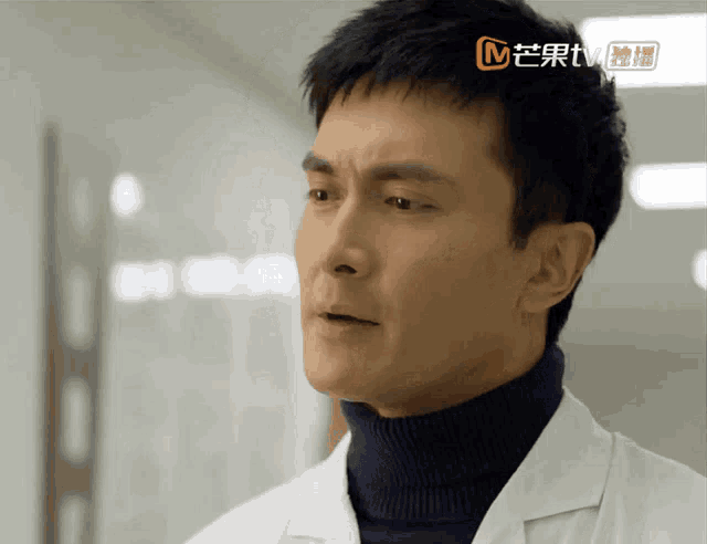 a close up of a man 's face with the letters mtv visible