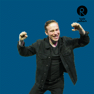 a man in a black jacket with his arms outstretched in front of a blue background that says teatr rozbork
