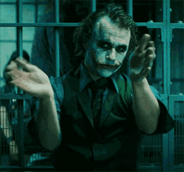 a close up of the joker 's face in a dark room