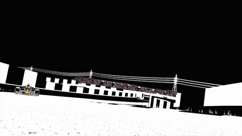 a red bull racing car is driving down the track