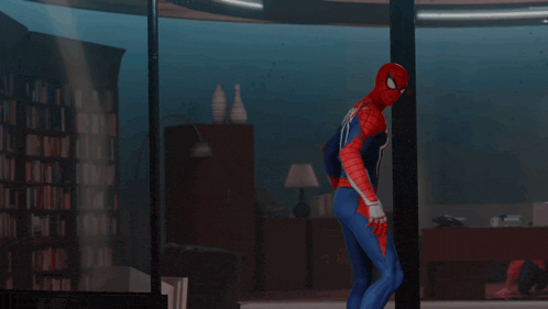 a man in a spiderman costume is flying through the air