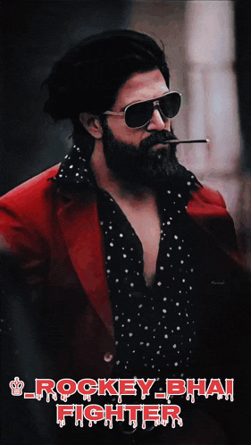a man with a beard wearing sunglasses and smoking a cigarette with the words rockey bhai fighter below him