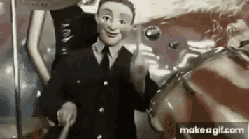 a man in a suit and tie is standing next to a woman in a mask .