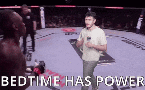 a man in a white shirt stands in a boxing ring with the words bedtime has power above him