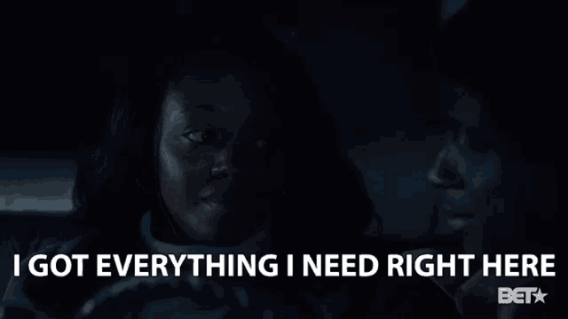 a woman sitting in a car with the words " i got everything i need right here " below her