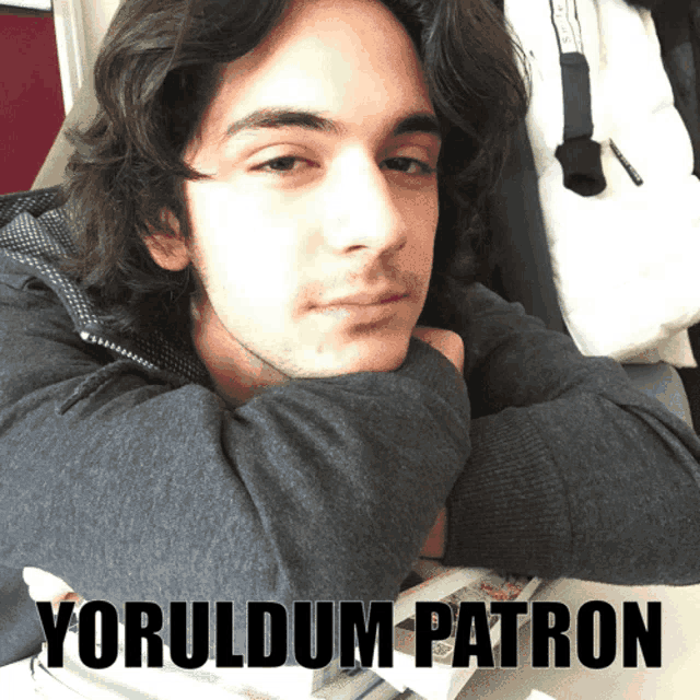 a picture of a young man with the words yoruldum patron on the bottom right