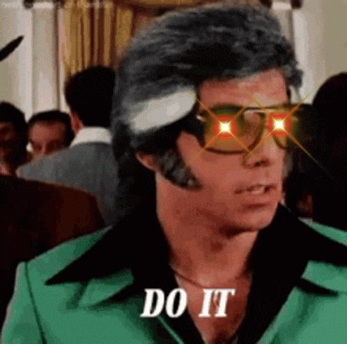 a man wearing sunglasses and a green suit is saying do it .