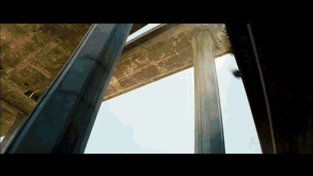 looking up at the pillars of a bridge
