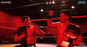 two men in a wrestling ring with the words premier wrestling on the bottom right