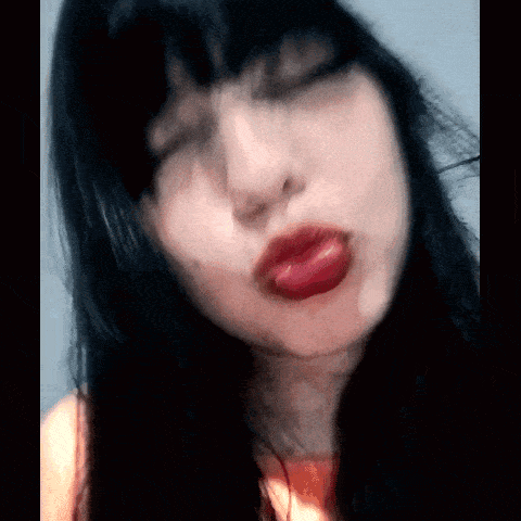 a close up of a woman with red lips