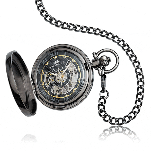 a black and gold pocket watch with the letter m on the front