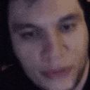 a close up of a person 's face with their eyes closed and mouth open .