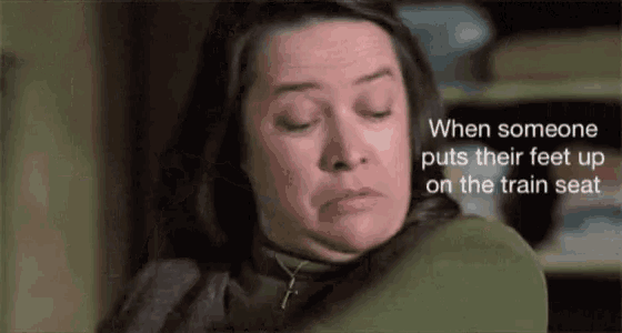 a woman in a green sweater with a caption that says when someone puts their feet up on the train seat