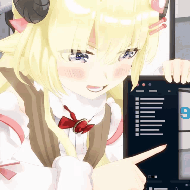 a girl with horns is pointing at a computer screen with the letter g on it