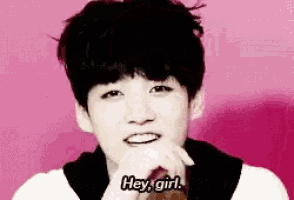 a young boy is smiling and says hey girl .