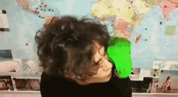 a person standing in front of a world map