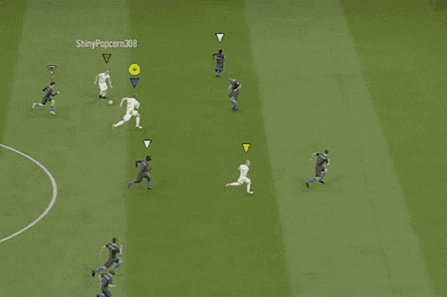 a soccer game is being played on a field with a goalie in the goal