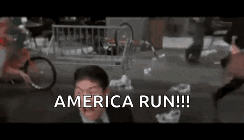 a man in a suit is running down a street with the words `` america run '' .
