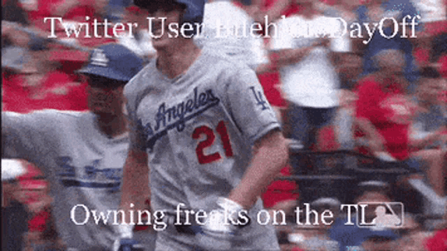 a baseball player with the number 21 on his jersey is running