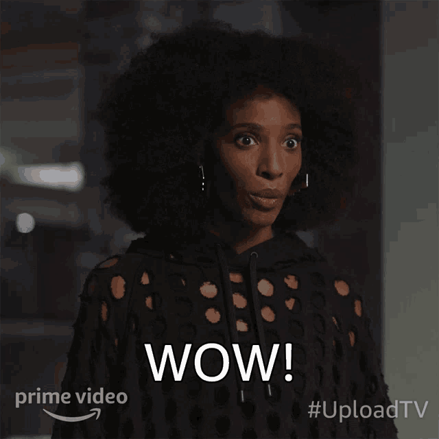 a woman with a surprised look on her face and the word wow on the bottom right