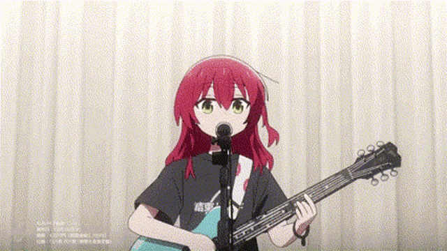 a girl with red hair is singing into a microphone while holding a guitar