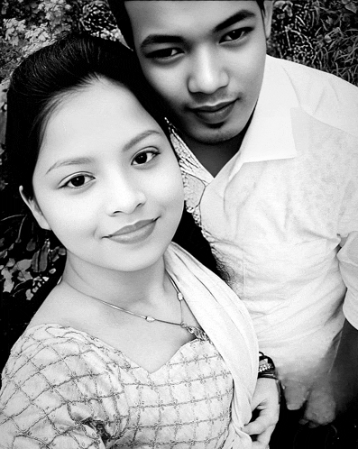 a black and white photo of a man and woman