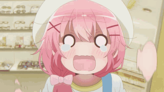 a girl with pink hair is making a funny face with her mouth open