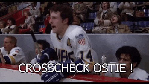 a hockey player with the number 4 on his jersey stands on the ice