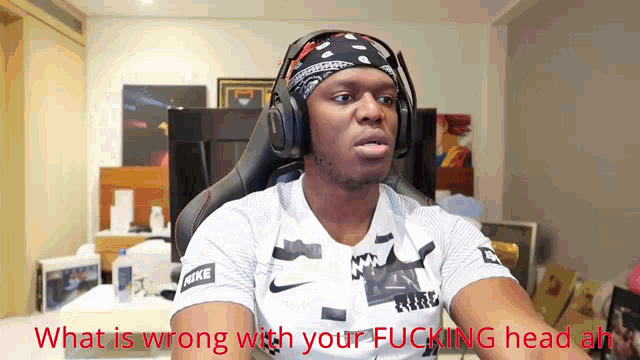 a man wearing headphones with the words what is wrong with your fucking head ah
