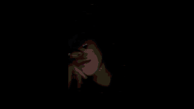 a blurry image of a person in a dark room