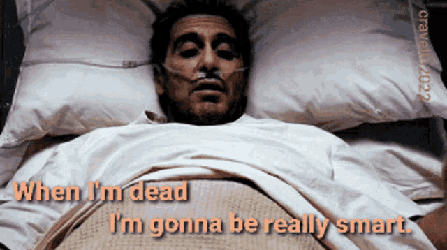 a man is laying in a hospital bed with an oxygen mask on his nose