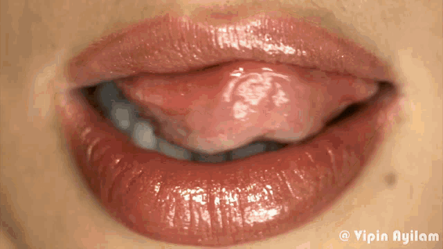 a close up of a woman 's mouth with a watermark that says ' yipin ayilam '