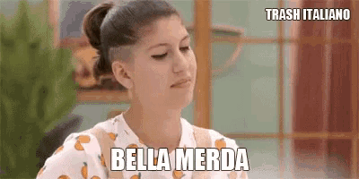 a woman says bella merda in a foreign language