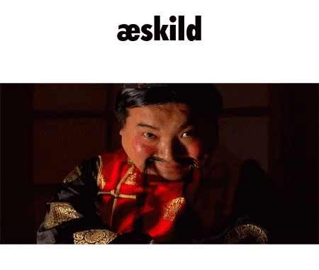a picture of a man with a fake mustache and the word aeskilde above him