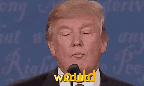 a close up of donald trump 's face with the word wodulkd in yellow