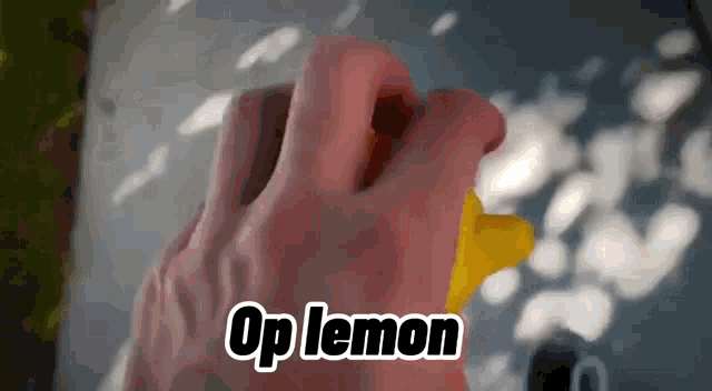 a close up of a person squeezing a lemon with the words op lemon written above it