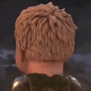 a close up of a child 's face with blonde hair and a sword .