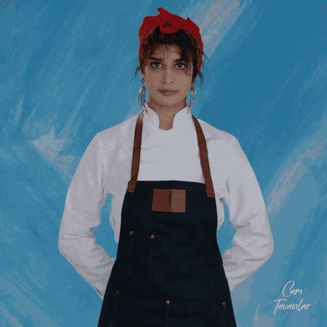 a woman wearing an apron and a white shirt is standing in front of a blue background that says cami tavanlar