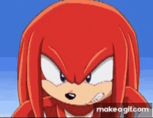 a close up of knuckles the echidna from sonic the hedgehog making a funny face .