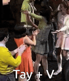 a group of people are dancing in a room with the words tay + v written on the bottom .