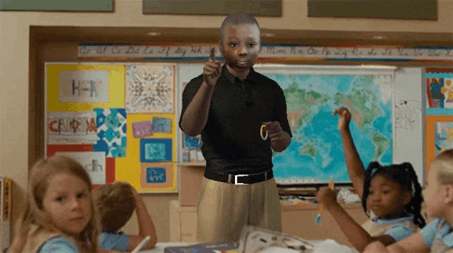 a teacher stands in front of a classroom with a map on the wall that says " california "