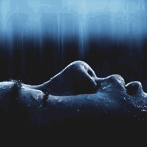 a close up of a person 's face covered in water