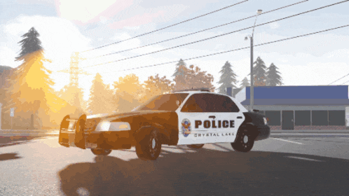 a police car from crystal lake is driving down the street